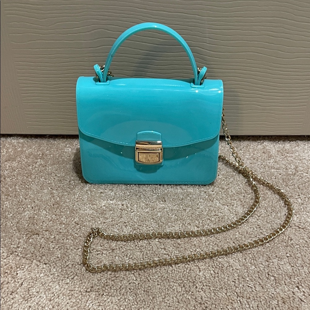 Elegant Blue Handbag with Gold Chain